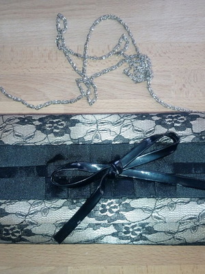 Evening handbag like new, black lace with gold and bow
