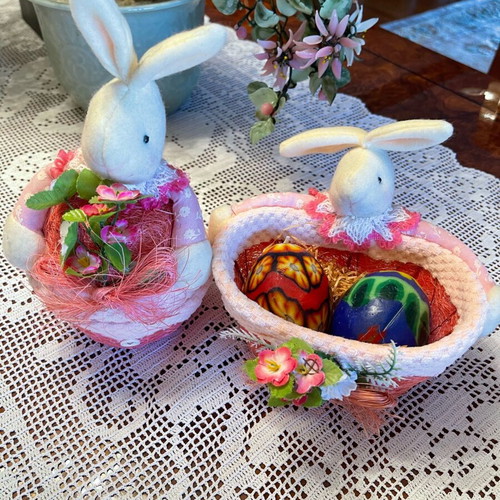 Easter decorations used, pink wicker baskets with rabbit and candle eggs