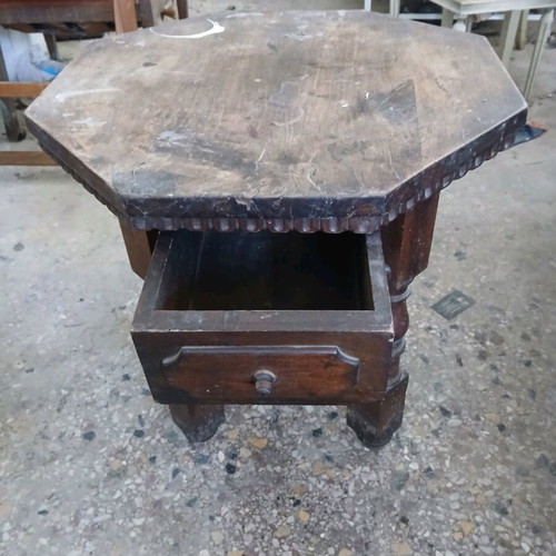 Vintage wooden table used, Victorian era with octagonal surface