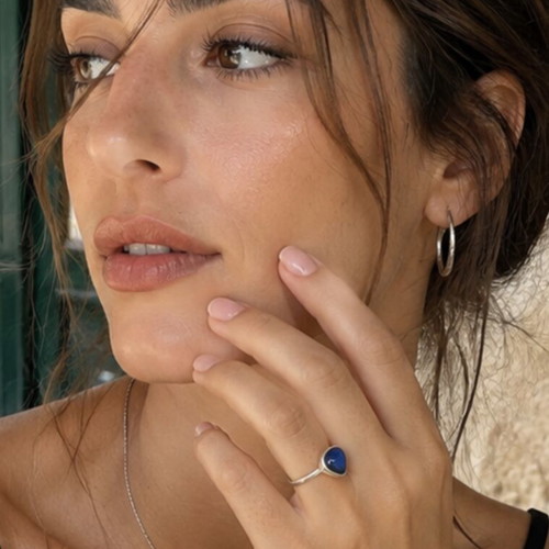 Silver ring with dark blue agate stone