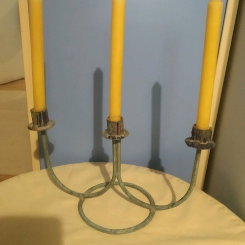 Vintage three-arm candlestick made of patinated brass like new