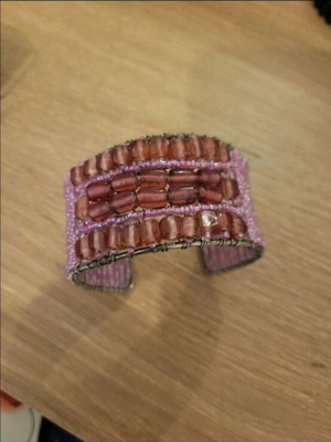 Handmade bracelet with beads in pink shades like new