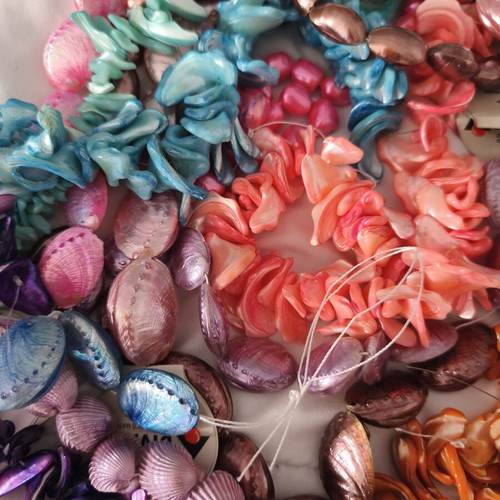 Jewelry making materials like new, shell chips, plastic and resin beads