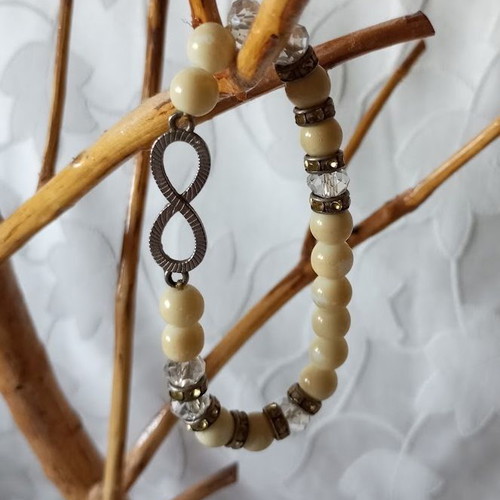 Bracelet with beads and infinity symbol new, cream and silver