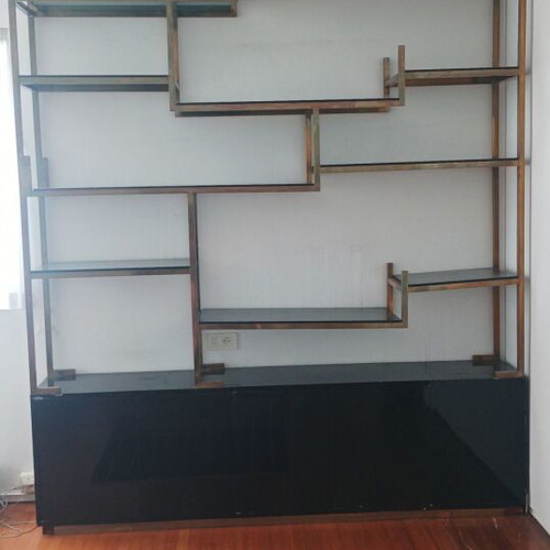 Bookcase used with asymmetric design, black lacquer and bronze detail