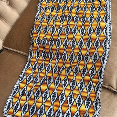 Embroidered table runner with diamond pattern