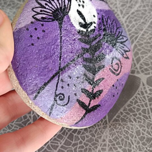 Painted stone new with acrylic colors and glossy varnish