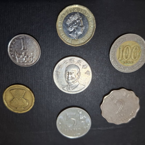 Collection of 7 Asian and European foreign coins