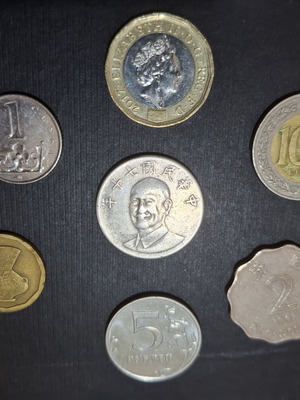 Collection of 7 Asian and European foreign coins