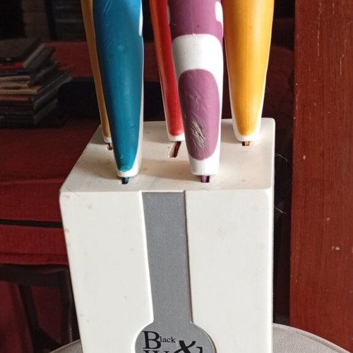 Black & White kitchen knives set used with colorful handles