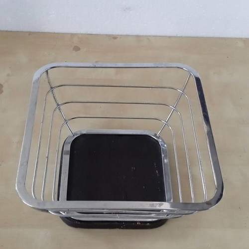 Metal fruit bowl with wooden base used