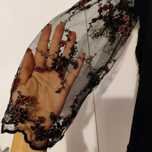 Black blouse used with three-quarter sleeves and embroidered flowers
