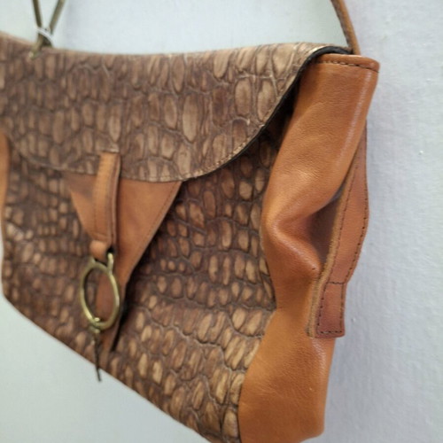 Vintage cowboy leather shoulder bag with metal accents like new