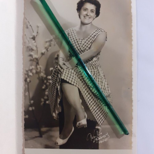 Two identical vintage photos of a woman in a photo studio, pack