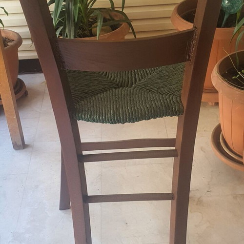 Wooden high chair with woven seat