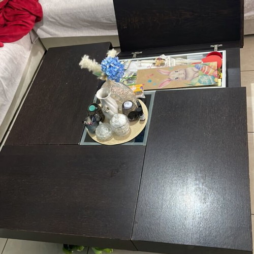 Coffee table made of solid wenge wood with storage and glass center