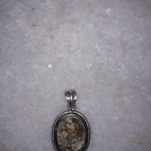 Silver pendant used with hallmark