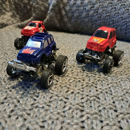 Set of 3 Monster Truck toy trucks like new with oversized wheels and suspensions