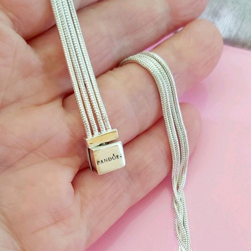 Pandora s925Ale Reflexions bracelet with four strands.