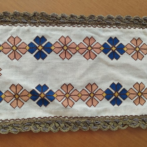 Vintage handmade embroidered table linens with cross-stitch and gold thread