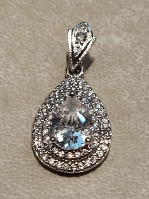 Luxury style pendant with zirconia stones, like new, silver color