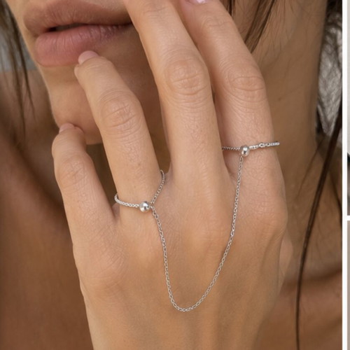 Silver hand chain with rings, modern designer style