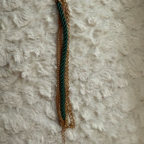 Steel bracelet new with green cord braided design