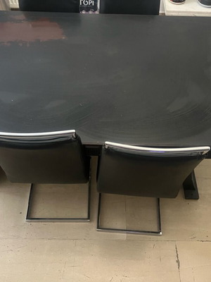 Table with four leather chairs used, heavy wood