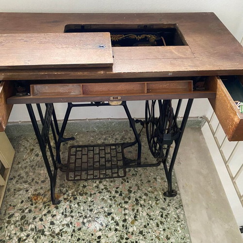 Naumann sewing machine used with cabinet and wheel