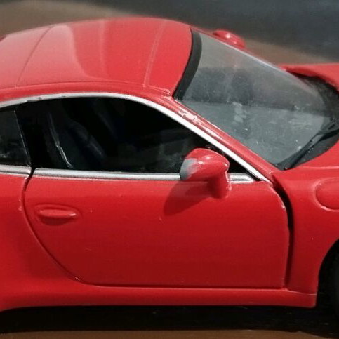 Collectible Porsche Carrera toy car with opening doors like new