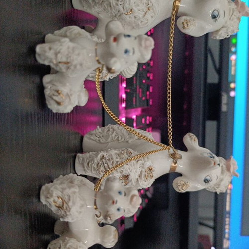 Porcelain poodle figures like new, mother, father and puppies