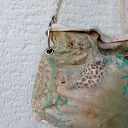 Shoulder bag in pouch style with leather details