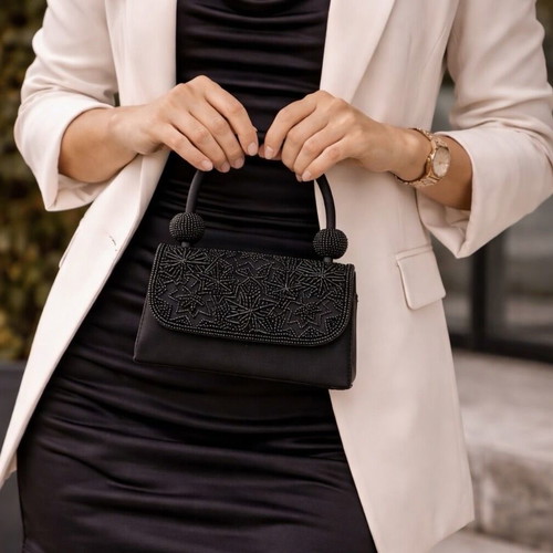Mini black handbag like new with beaded embossed design