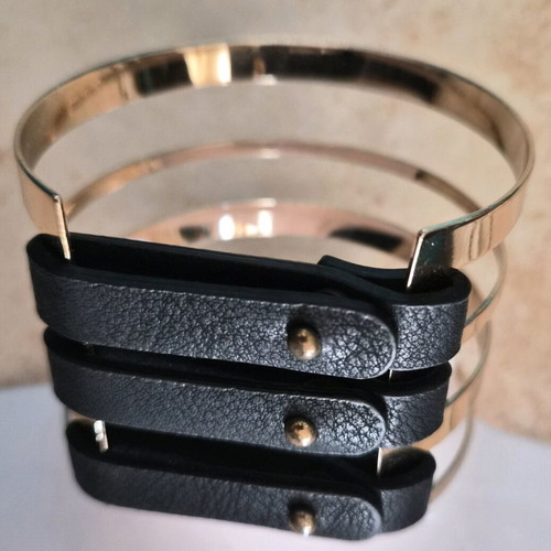 Metal cuff bracelet in rose gold color with black details like new