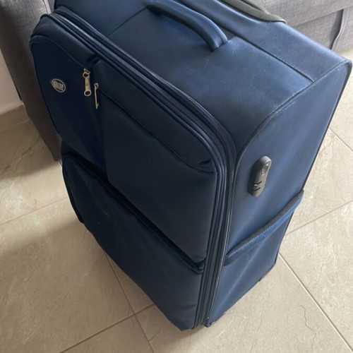 Large suitcase like new, blue, with 360-degree wheels and lock system