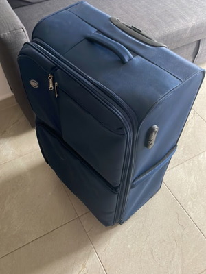 Large suitcase like new, blue, with 360-degree wheels and lock system