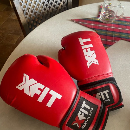 Boxing gloves and rugby ball like new