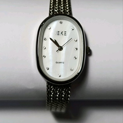Silver women's watch like new with mesh bracelet and rhinestones