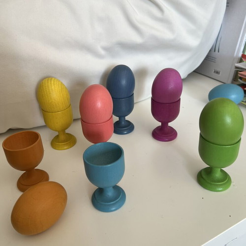 Wooden baby toy with colored eggs and egg cups