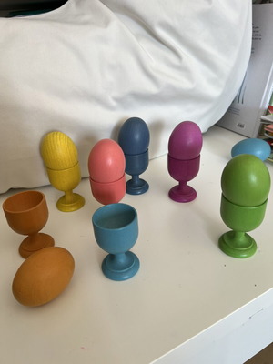 Wooden baby toy with colored eggs and egg cups