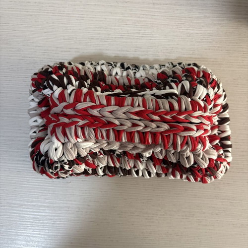 Handmade crochet clutch bag with fabric