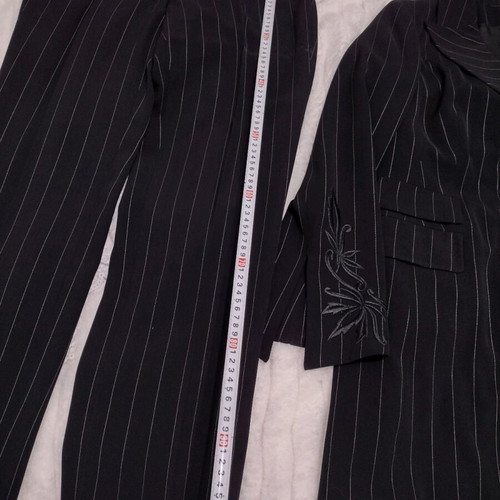 Women's black two-piece suit like new with white pinstripe size M