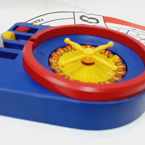Vintage children's roulette game, like new, blue plastic, nylon mat