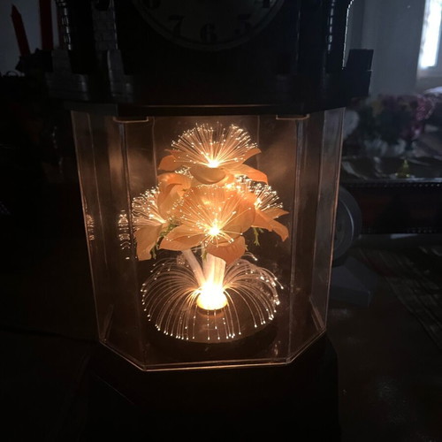 Table clock used collectible with lighting and rotating flower