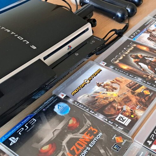 Playstation 3 like new with Move and 14 games