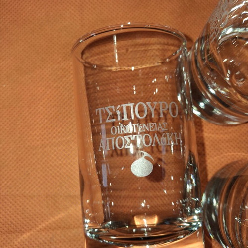 Set of 12 glass tsipouro glasses "ΟΙΚΟΓΕΝΕΙΑΣ ΑΠΟΣΤΟΛΑΚΗ" like new