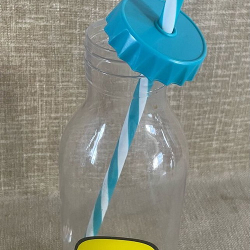 Plastic Transparent Bottle with Straw and Emoji Face Used