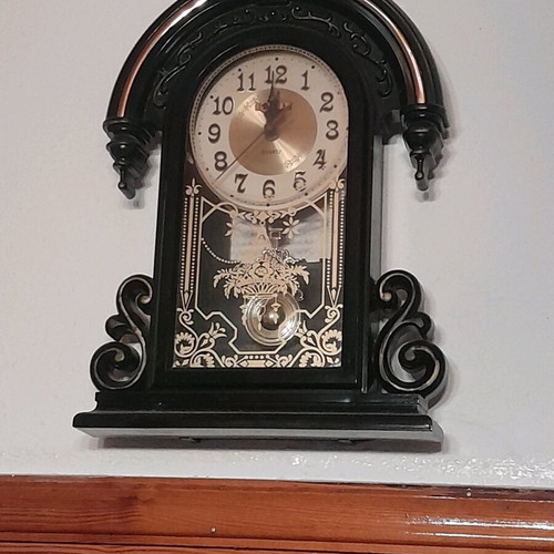 Antique wall clock hanging used