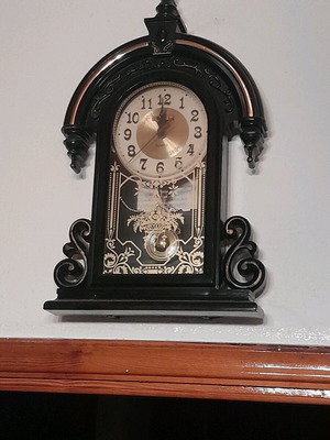 Antique wall clock hanging used