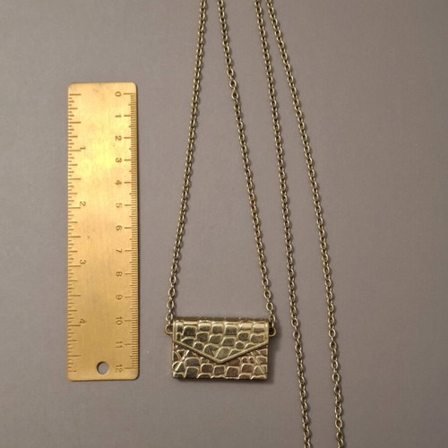 Abysse pendant bag in gold tone with chain used